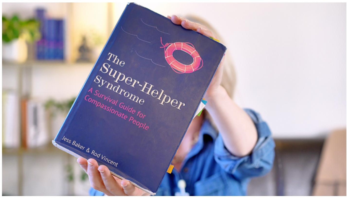 Jess Baker holding The Super-Helper Syndrome